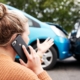 a frustrated woman on the phone after a car accident