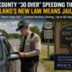 Maryland State Police officer issuing a speeding ticket on a rural highway in Kent County, highlighting Maryland's new criminal reckless driving law for speeds 30 mph or more over the limit.